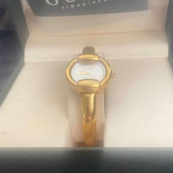 Gucci Accessories - Gucci Gold Tone Ladies Bangle Watch with White Dial